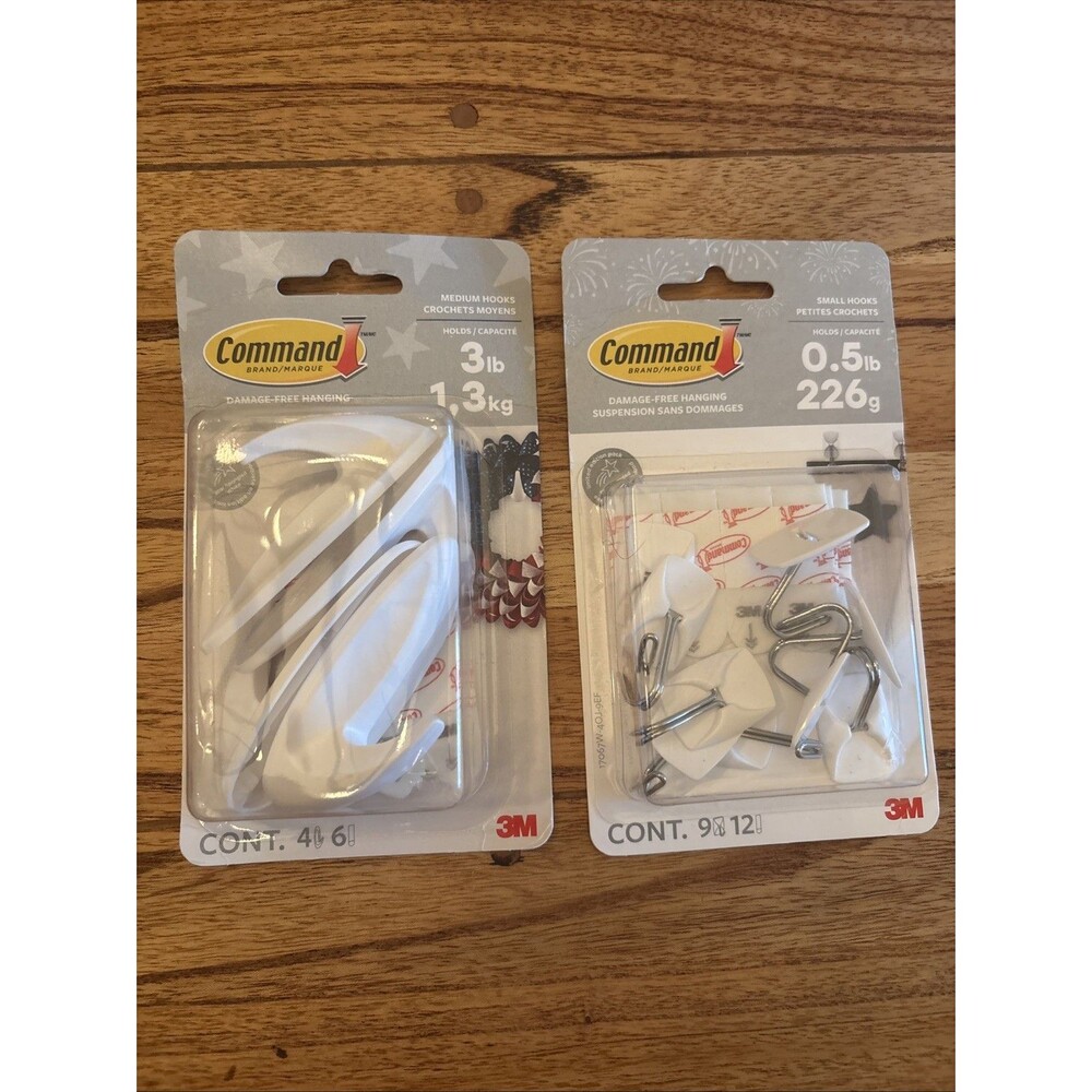 2 Packs Of Command Strips. Pack Of 4 Medium Hooks & Pack Of  9 Small Hooks